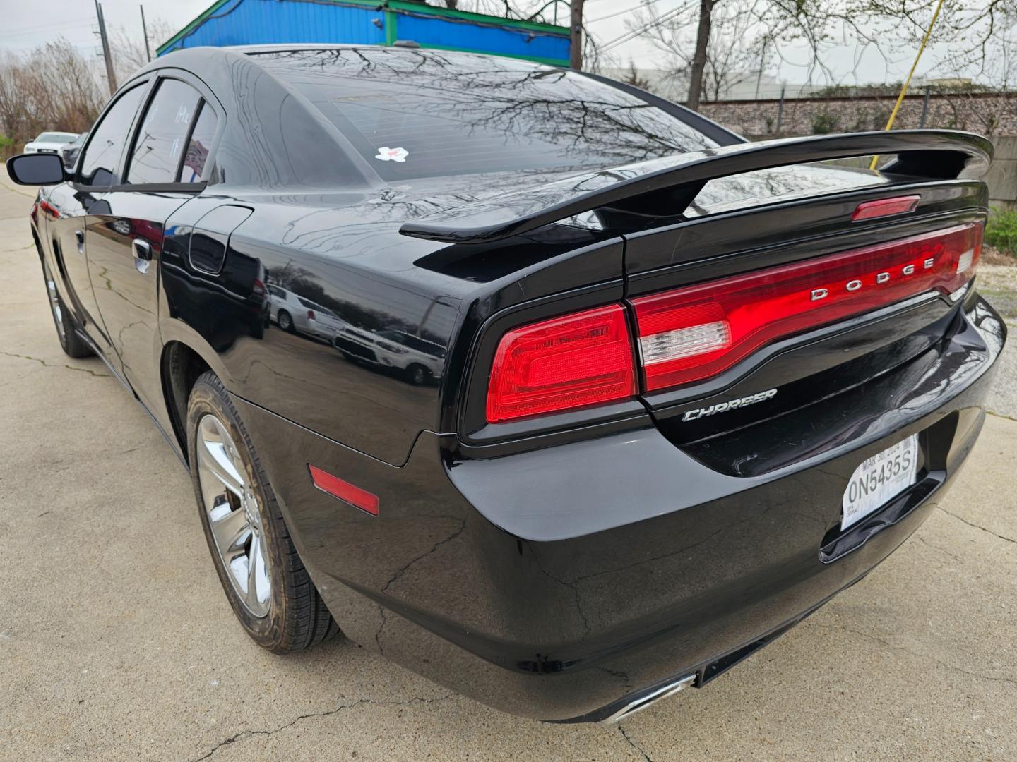 2014 Black Dodge Charger SE (2C3CDXBG6EH) with an 3.6L V6 DOHC 24V engine, 5-Speed Automatic transmission, located at 2020 East Division Street, Arlington, TX, 76011, (817) 801-3191, 32.742390, -97.076874 - Premiere Buy Here Pay Here with NO Credit Check (score) at 2020 East Division Street, Arlington, Texas, located in the center of the Dallas/Fort Worth metro area. For in-house financing in Lancaster, Waxahachie, Cleburne, Sherman, Denton, McKinney, Waco, Weatherford, Grand Prairie to Plano (along wi - Photo#1